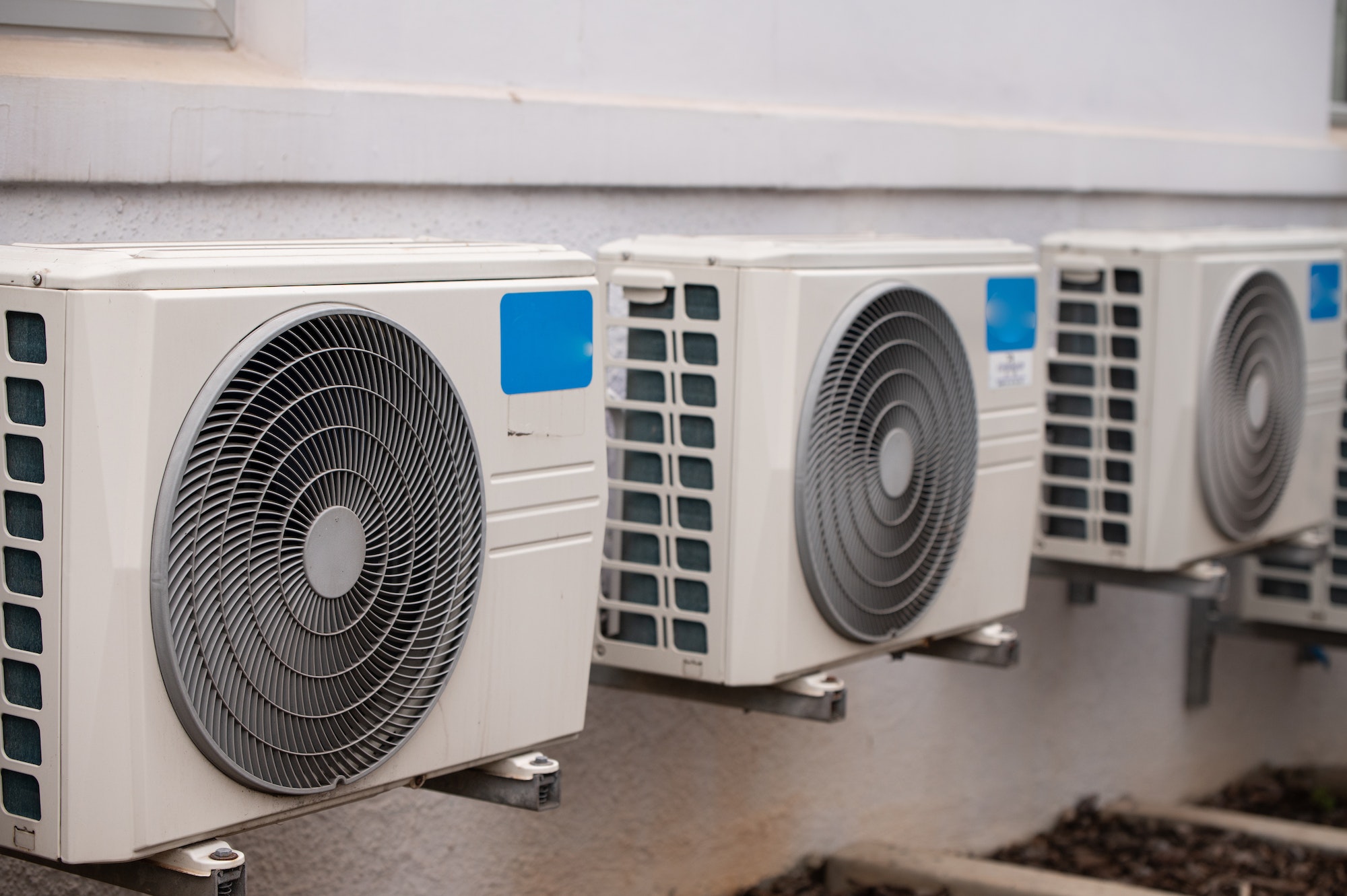 Air conditioners mounted on wall outdoors