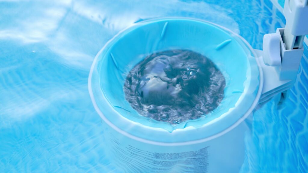 Pool maintenance - skimmer basket collects dirt and trash. Filtration system equipment installed