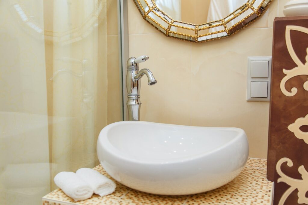 Luxurious bathroom plumbing in hotel room. Bathroom interior elements.